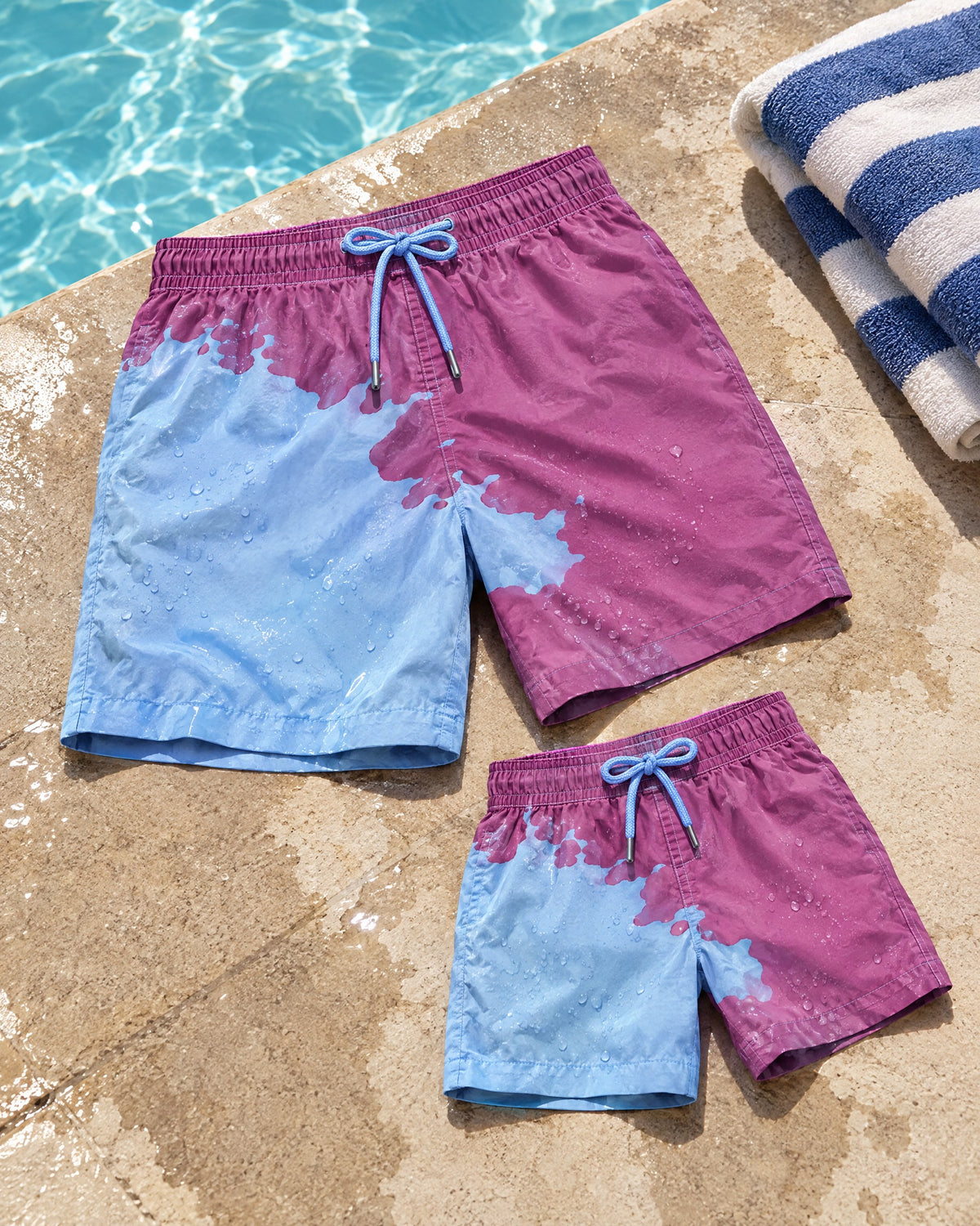 Dad & Mini matching colour-changing swim shorts set in Purple to Blue by the pool