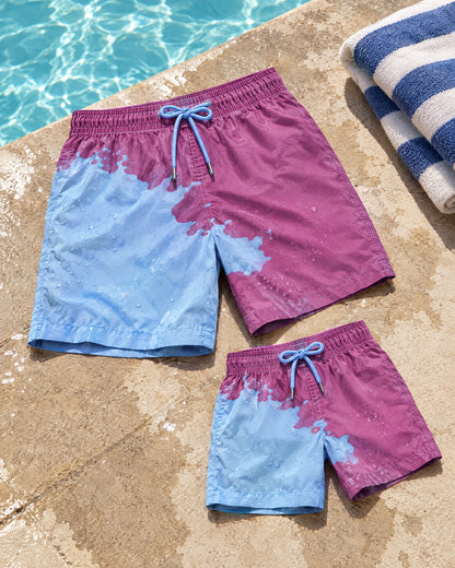 Dad & Mini matching colour-changing swim shorts set in Purple to Blue by the pool