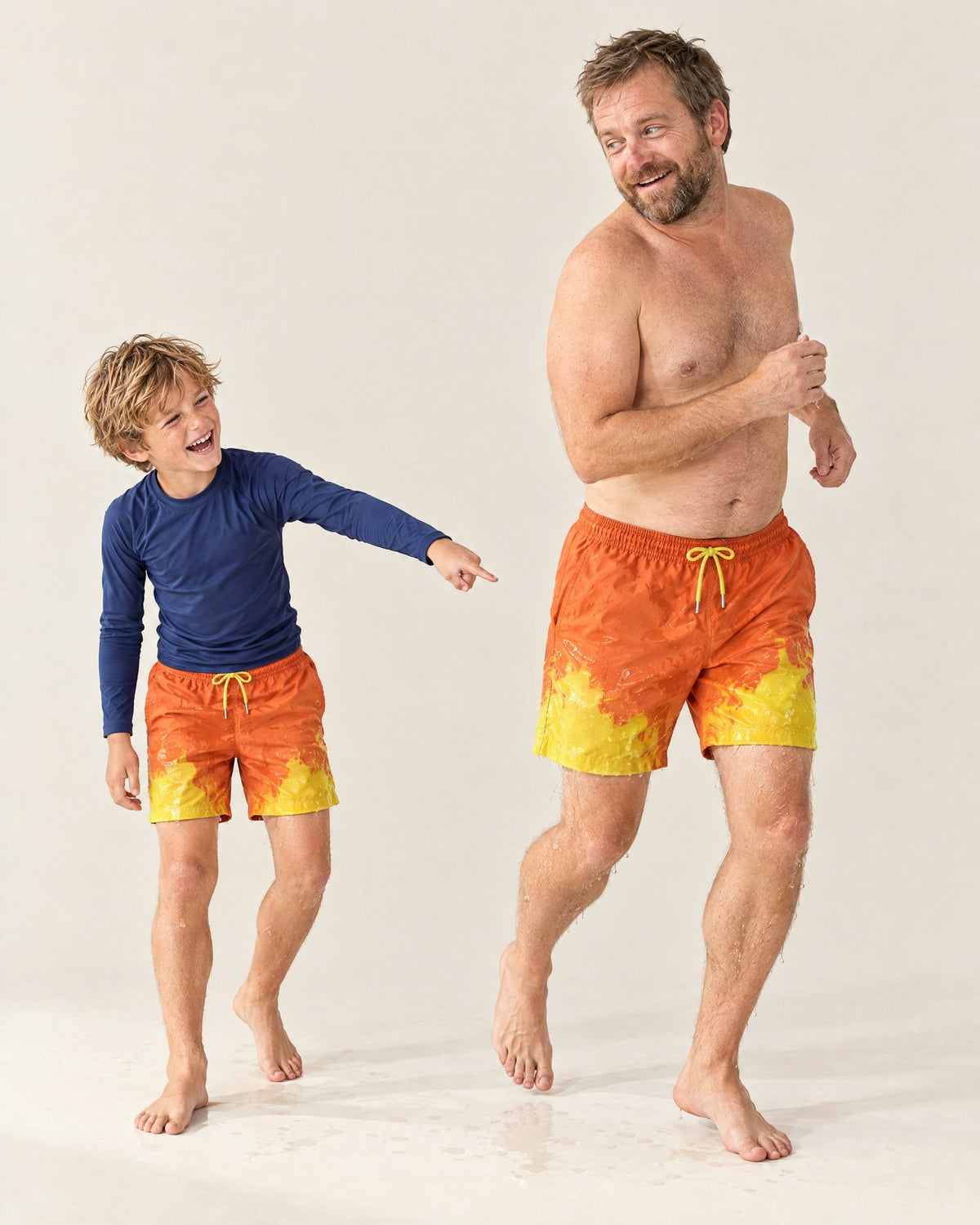 The same Orange to Yellow shorts a second after a splash: yellow wherever the water landed