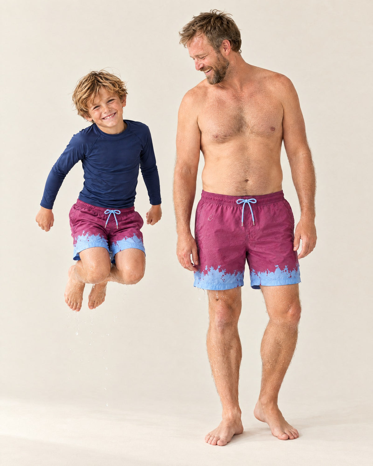 The same Purple to Blue shorts a second after a splash: blue wherever the water landed