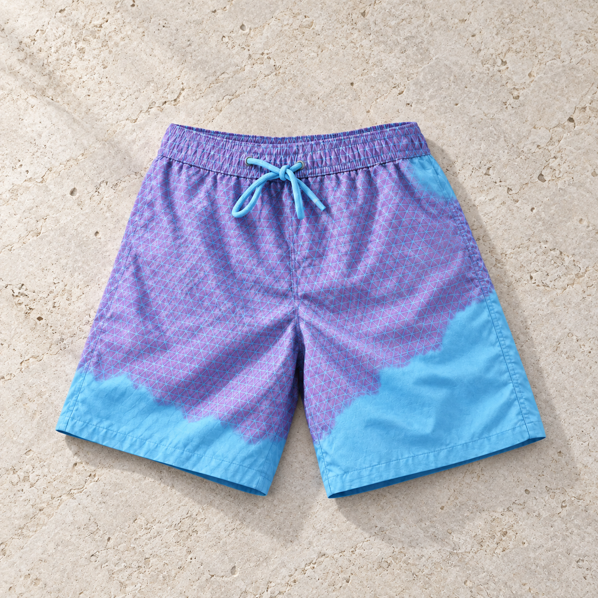 Shift Geometric colour-changing swim shorts, Purple to Blue, on sand