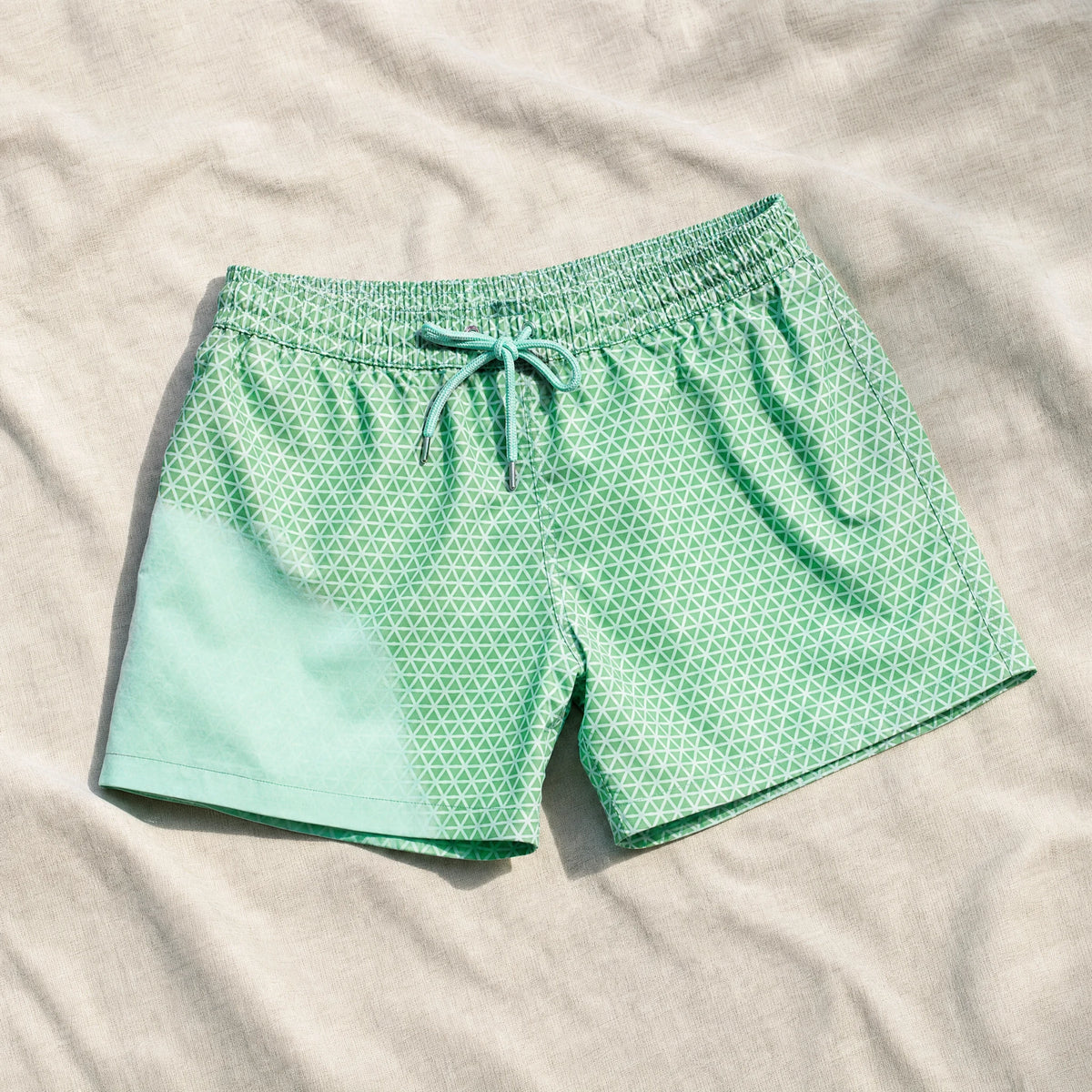 Shift Geometric colour-changing swim shorts, Green to Mint, on linen