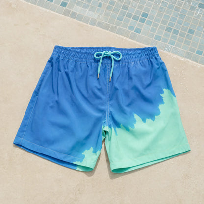 Shift men's colour-changing swim shorts, Blue to Green, on pool tiles