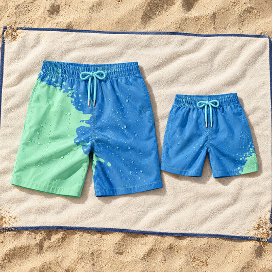 Shift Dad & Mini matching set in Blue to Green on a beach towel