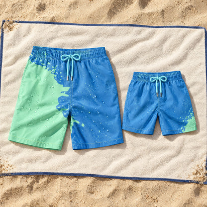 Shift Dad & Mini matching set in Blue to Green on a beach towel