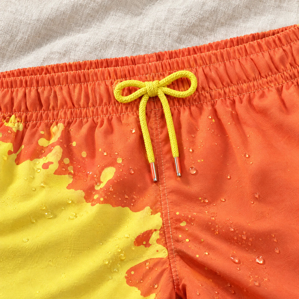 Close-up of the drawcord and elastic waist on Shift Orange to Yellow swim shorts