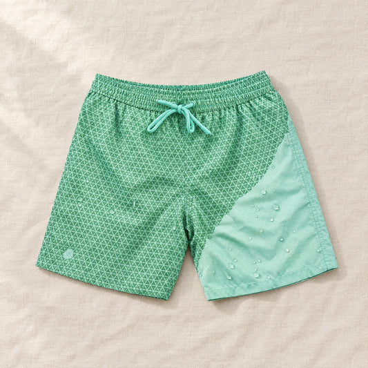 Shift Geometric Green to Mint swim shorts on linen, showing both colours