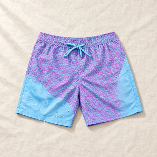 Shift Geometric Purple to Blue swim shorts on linen, showing both colours