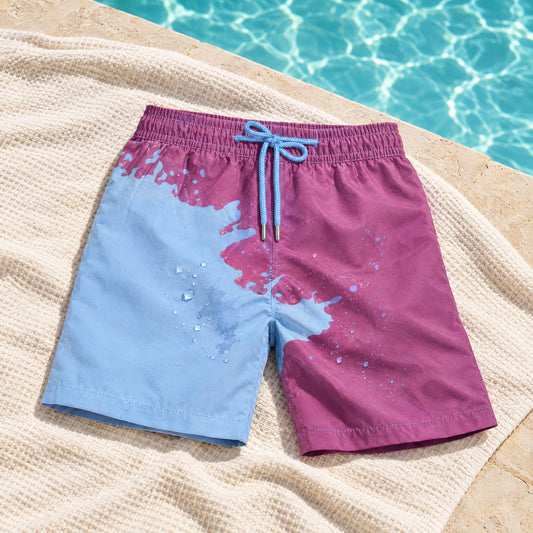 Shift Purple to Blue swim shorts on a poolside towel, showing both colours